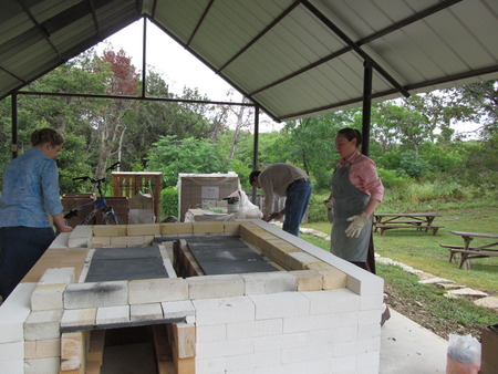 The first course of bricks for the firing chamber